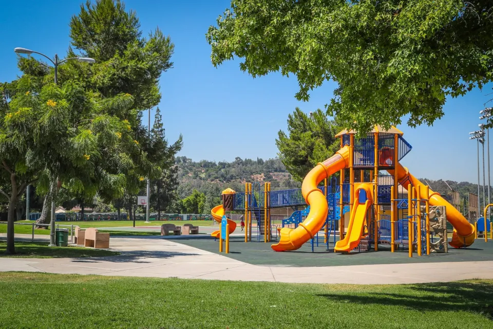 Playground with yellow slides in Rimgrove Park, Los Angeles County